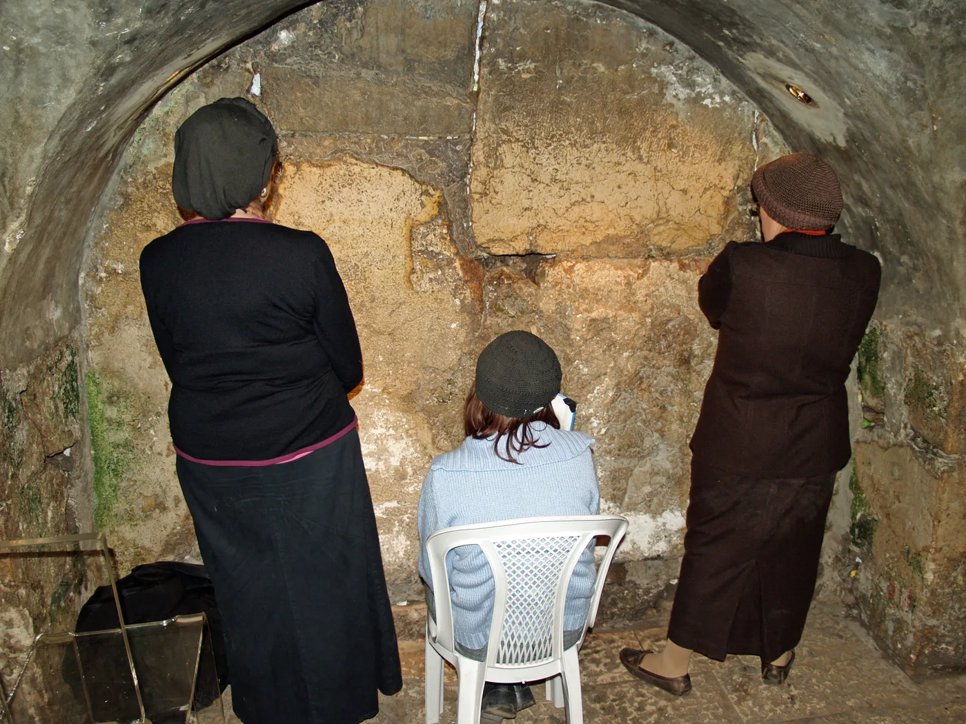 Women praying at Warren's Gate inside the Western Wall Tunnels in Jerusalem