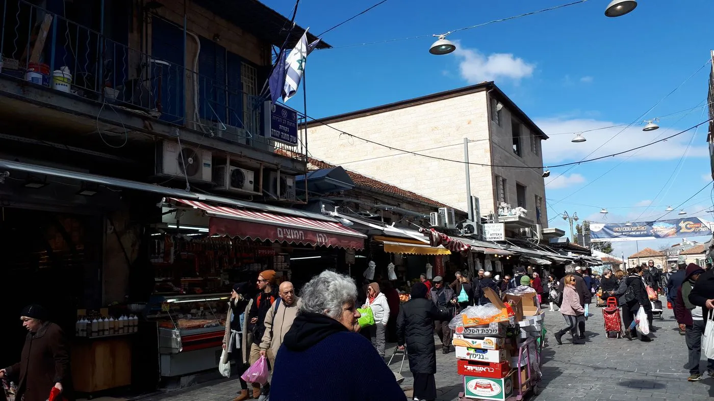 Stalls and shoppers in Mahane Yehuda market, Jerusalem