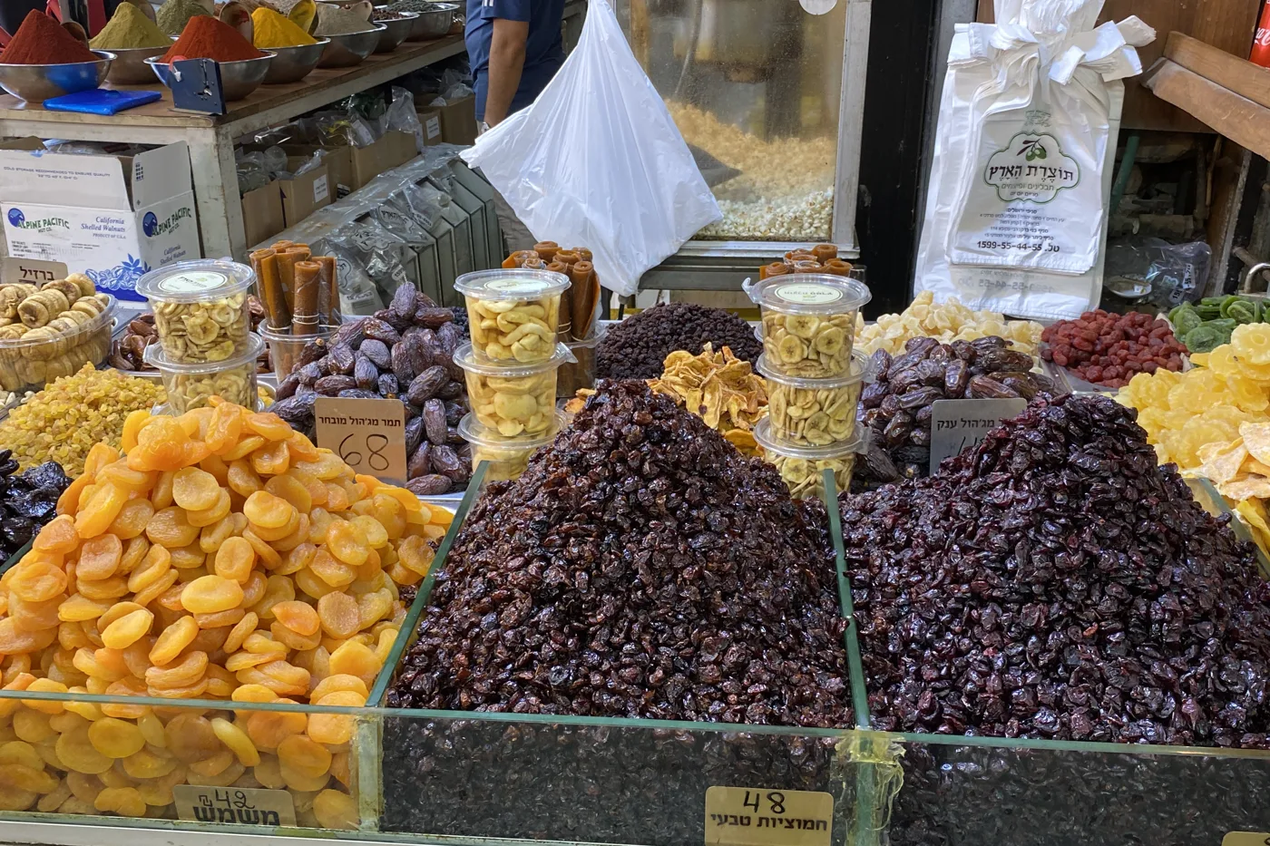 Dried fruit and spices for sale at a Mahane Yehuda market stall