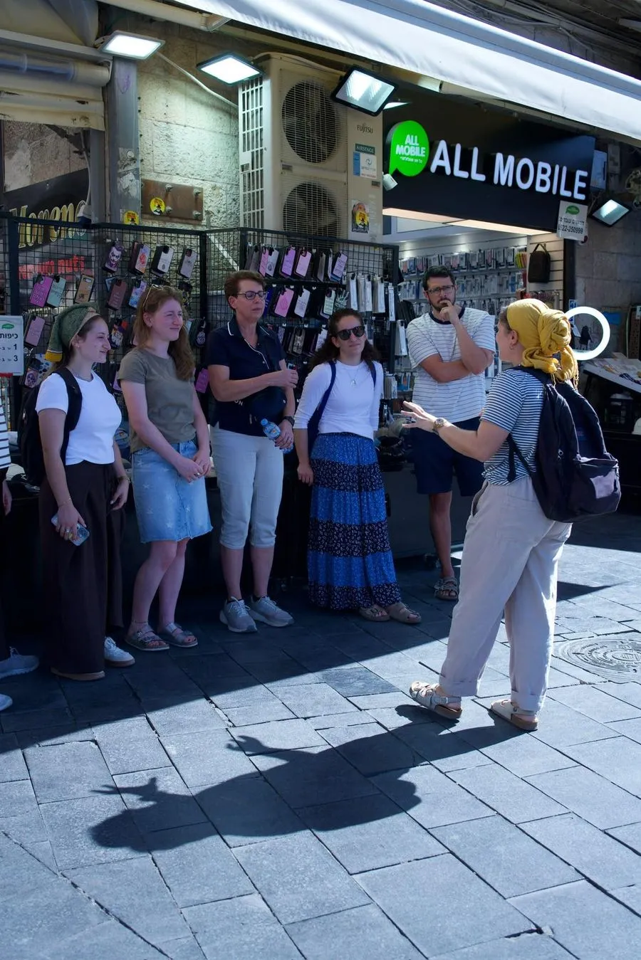 Orit guiding tourists through Mahane Yehuda market